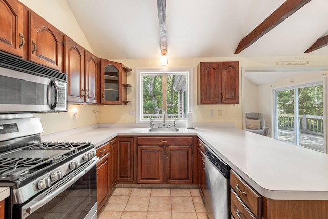 66 Chuckles Way, Marstons Mills, MA 02648 - kitchen featuring stainless steel appliances, a peninsula, light countertops, and light tile patterned floors