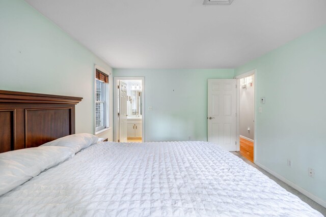 66 Chuckles Way, Marstons Mills, MA 02648 - bedroom with baseboards and ensuite bath