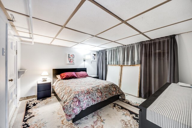 bedroom with a paneled ceiling