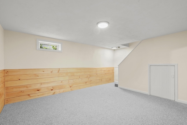 basement with carpet floors and baseboards