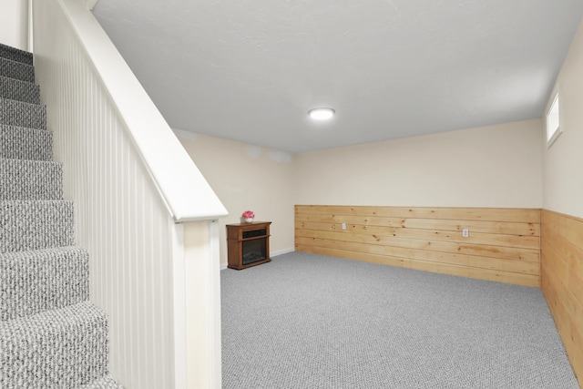 basement featuring carpet and stairway
