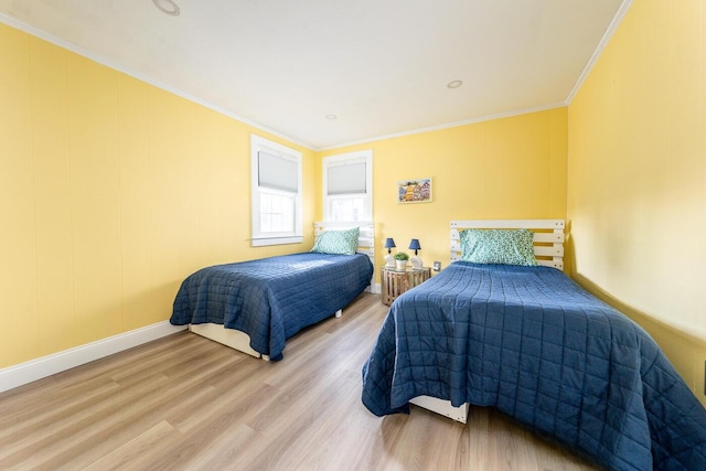 bedroom with wood-type flooring and ornamental molding