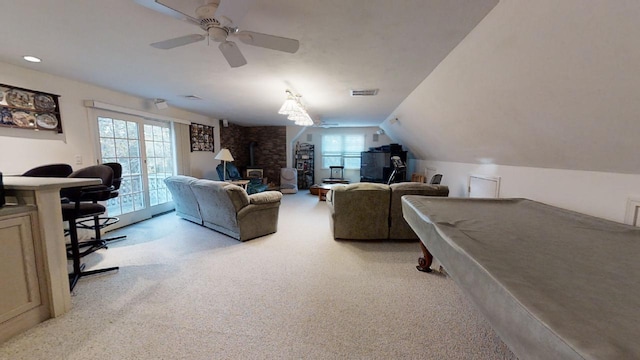 living room featuring light colored carpet, pool table, lofted ceiling, and a healthy amount of sunlight