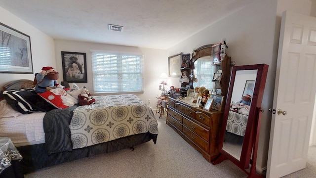 bedroom with light carpet