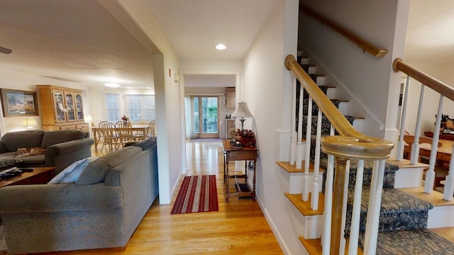 stairs with hardwood / wood-style floors