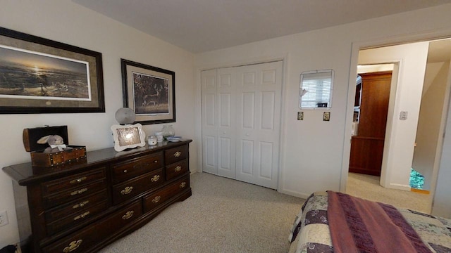 carpeted bedroom with a closet