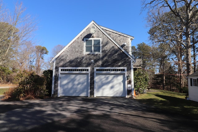 view of side of property with a garage