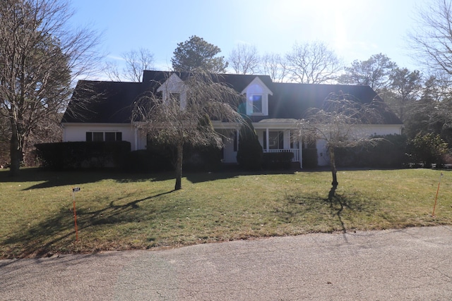 new england style home with a front yard