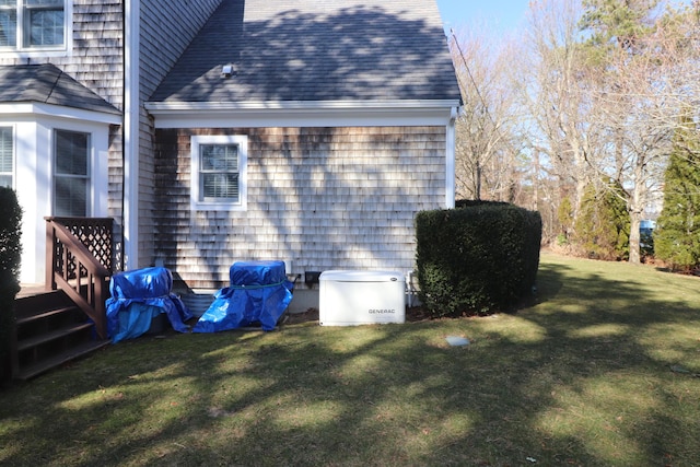 view of home's exterior with a lawn