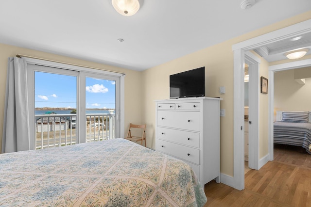 496 Shore Rd Unit 16, Truro, MA 02666 - bedroom with access to outside, baseboards, and wood finished floors