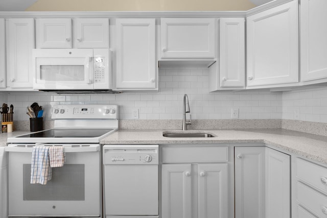 496 Shore Rd Unit 16, Truro, MA 02666 - kitchen featuring white appliances, white cabinets, decorative backsplash, and a sink