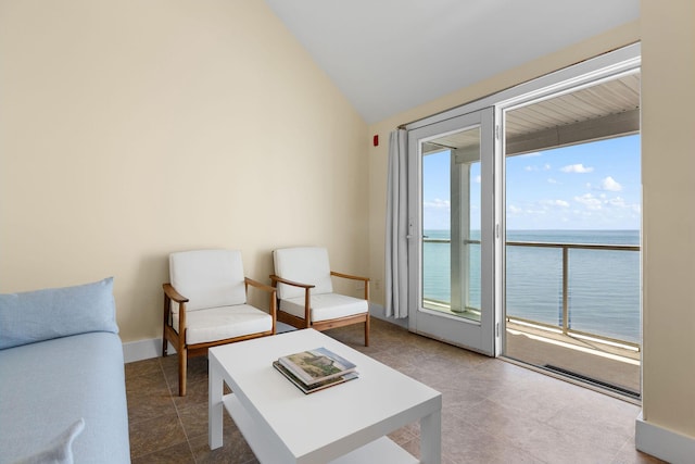 496 Shore Rd Unit 16, Truro, MA 02666 - sitting room featuring a water view, baseboards, tile patterned flooring, and lofted ceiling