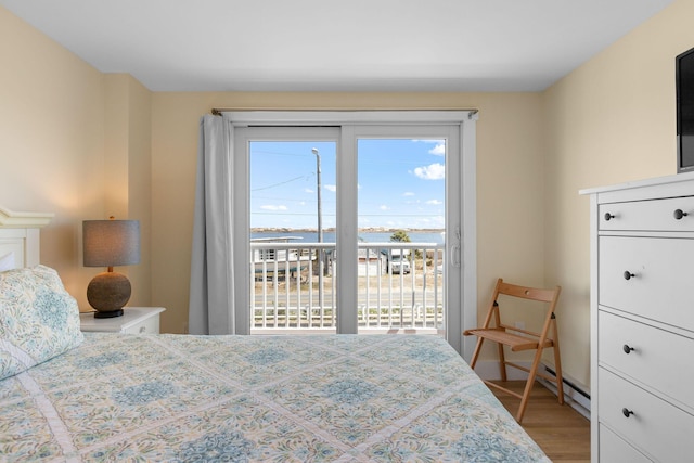 496 Shore Rd Unit 16, Truro, MA 02666 - bedroom with light wood-style flooring and access to exterior