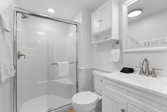 496 Shore Rd Unit 16, Truro, MA 02666 - full bath with toilet, a shower stall, a wainscoted wall, and vanity