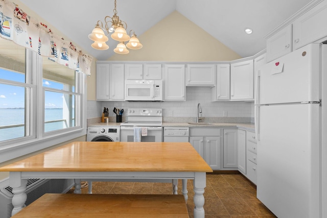 496 Shore Rd Unit 16, Truro, MA 02666 - kitchen featuring white appliances, light countertops, white cabinets, a sink, and a notable chandelier