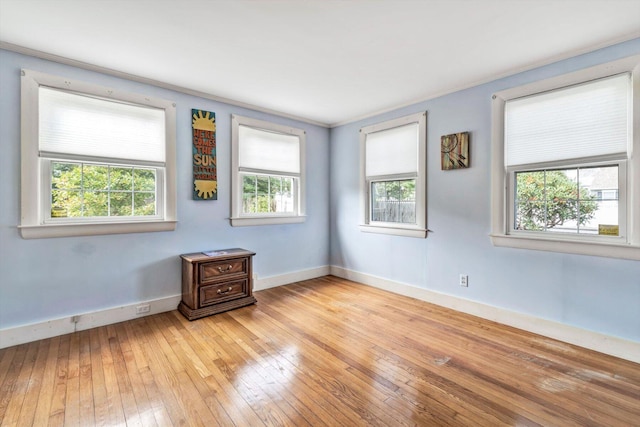 unfurnished room with light hardwood / wood-style flooring