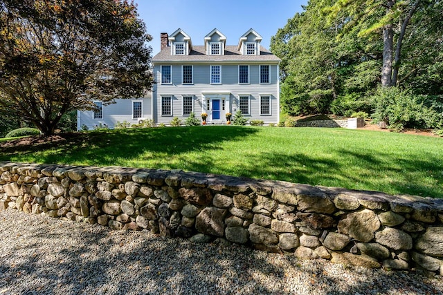 colonial home with a front lawn