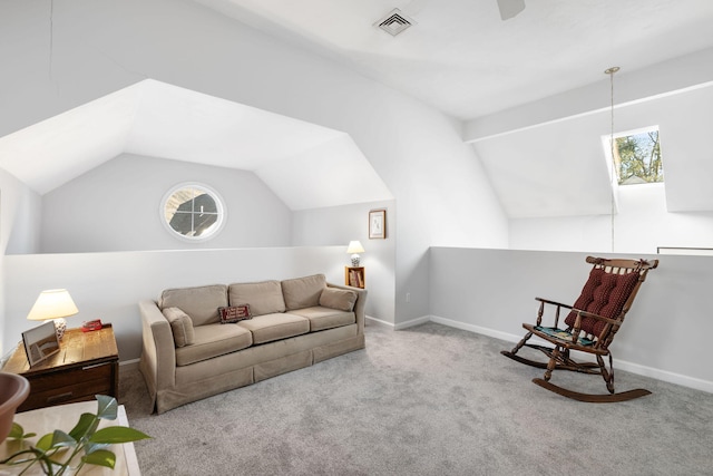 carpeted living room featuring vaulted ceiling with beams