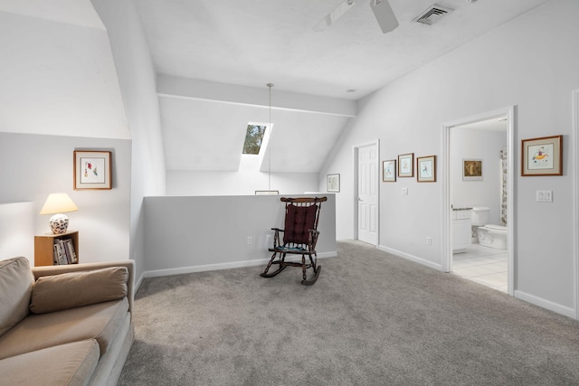 sitting room featuring lofted ceiling, light carpet, and ceiling fan