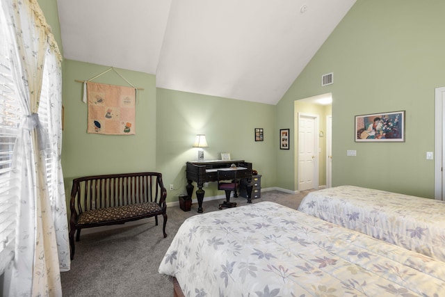 carpeted bedroom with vaulted ceiling