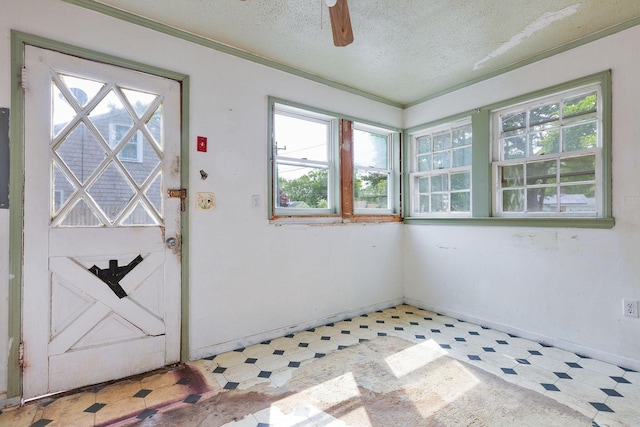 91 Baxter Rd, Hyannis, MA 02601 - foyer featuring healthy amount of natural light, light floors, a textured ceiling, and ceiling fan