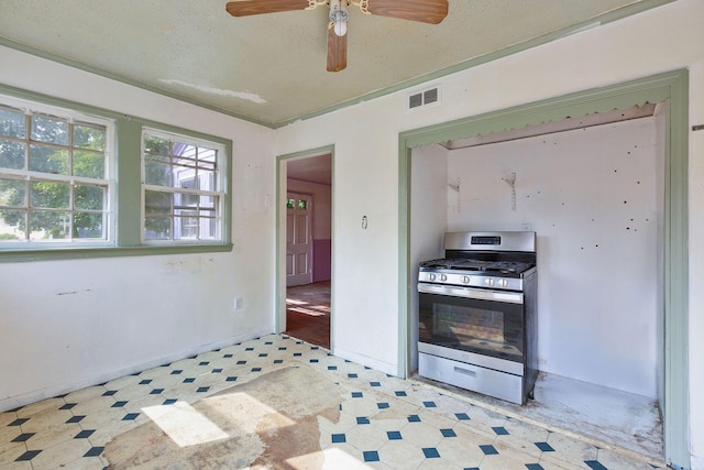 91 Baxter Rd, Hyannis, MA 02601 - kitchen featuring stainless steel range with gas cooktop, ceiling fan, and tile patterned floors