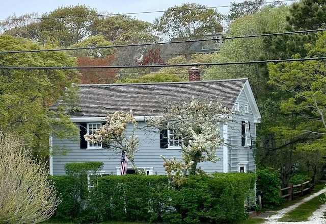 view of home's exterior with a chimney