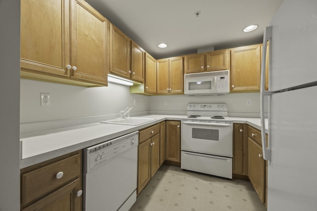 kitchen with sink and white appliances