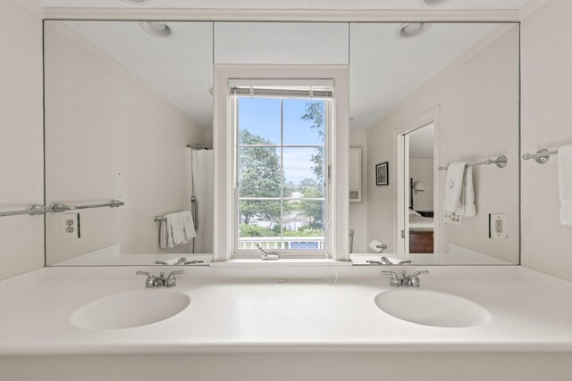 bathroom featuring vanity, a shower with shower door, and toilet