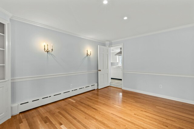 bedroom with carpet flooring, crown molding, and baseboard heating