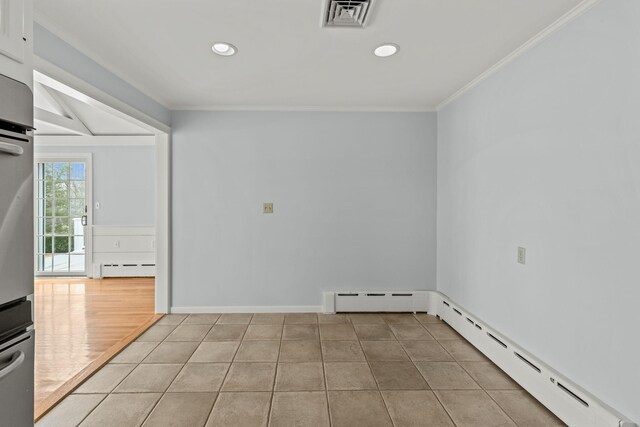 dining room featuring hardwood / wood-style flooring, crown molding, and built in features