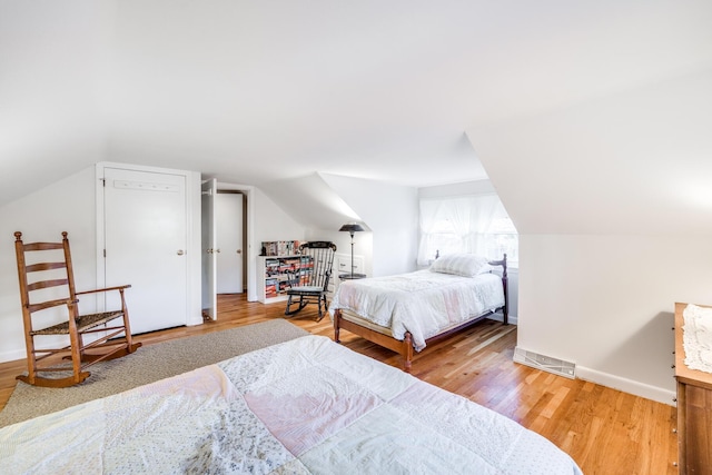 38 Rainbow Way, Harwich, MA 02645 - bedroom with light wood finished floors, vaulted ceiling, and baseboards