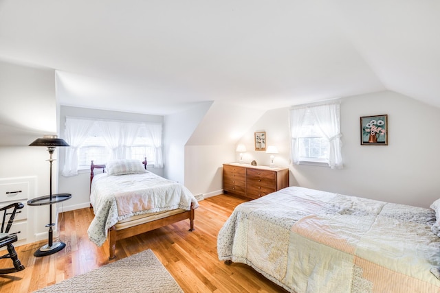 38 Rainbow Way, Harwich, MA 02645 - bedroom featuring light wood-style floors, lofted ceiling, and multiple windows