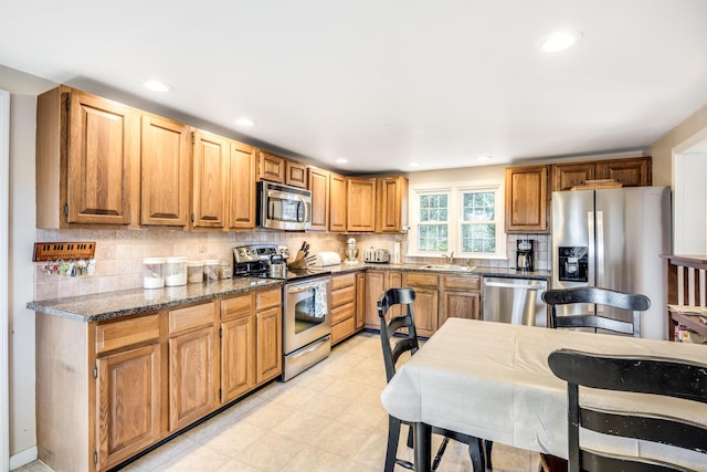 38 Rainbow Way, Harwich, MA 02645 - kitchen featuring recessed lighting, tasteful backsplash, appliances with stainless steel finishes, and light floors