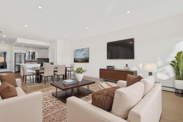 living room with light hardwood / wood-style flooring