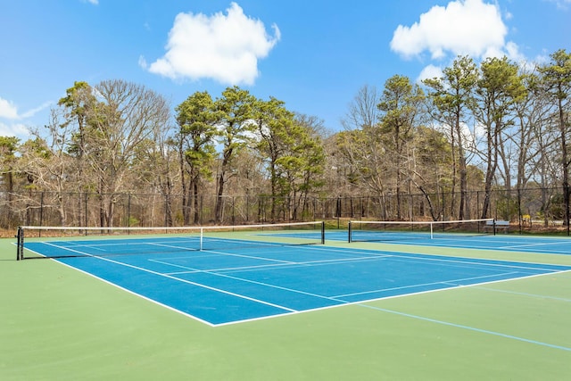 view of sport court with community basketball court and fence
