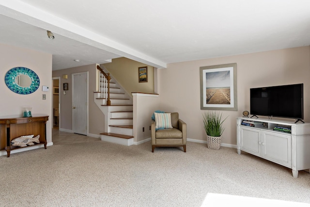 living area featuring stairway, carpet floors, and baseboards