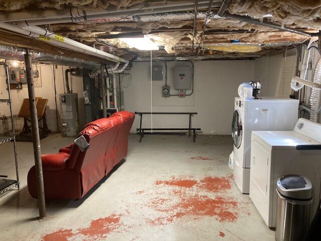 25 Buckwood Dr, South Yarmouth, MA 02664 - unfinished below grade area featuring washer and dryer and gas water heater
