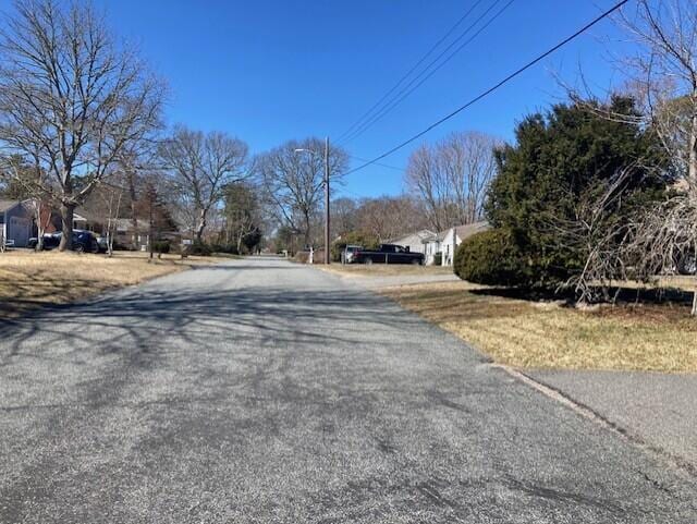 25 Buckwood Dr, South Yarmouth, MA 02664 - view of asphalt street featuring street lighting