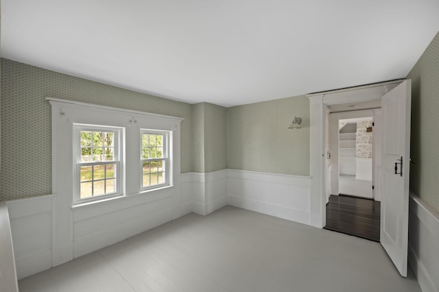 36 Uncle Barneys Rd, West Dennis, MA 02670 - unfurnished room with wainscoting and wallpapered walls