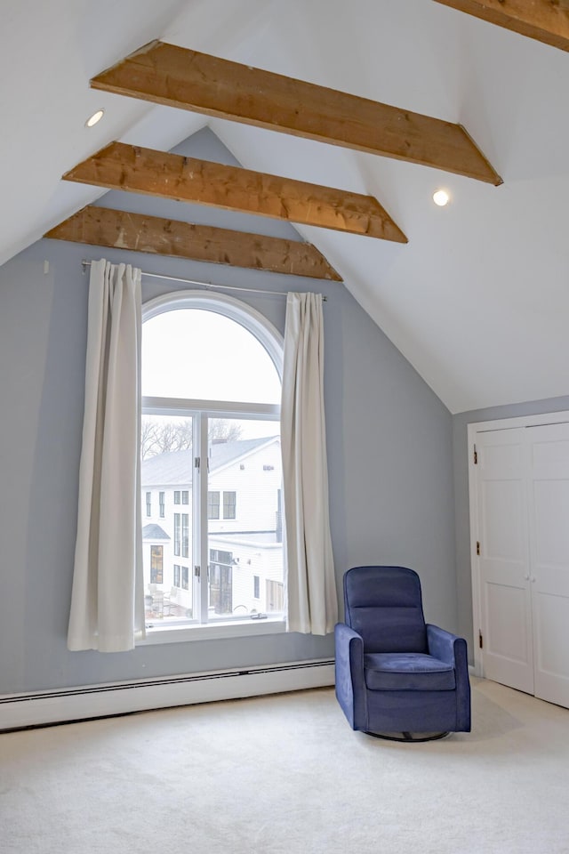 sitting room featuring a baseboard radiator, carpet floors, and vaulted ceiling with beams