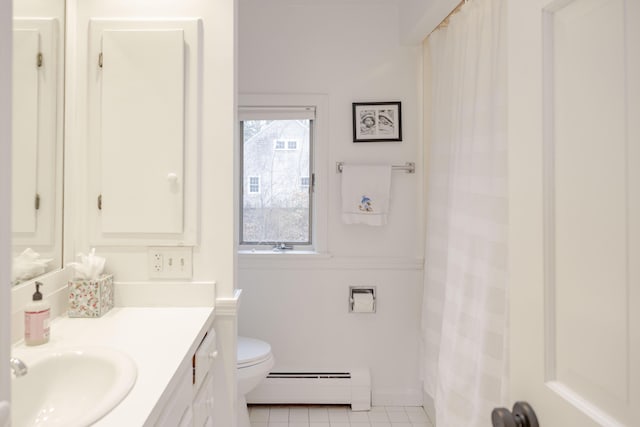 bathroom featuring vanity, a baseboard heating unit, tile patterned floors, and toilet