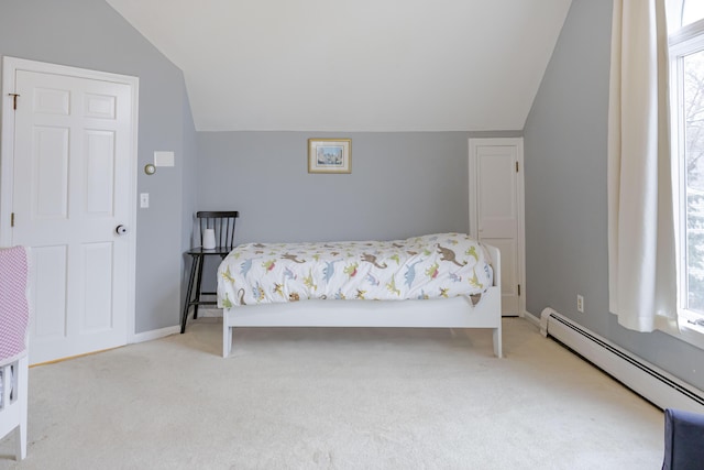 bedroom with multiple windows, lofted ceiling, a baseboard heating unit, and light colored carpet