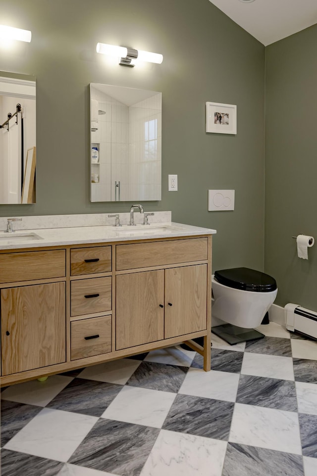 bathroom featuring vanity, toilet, baseboard heating, and walk in shower