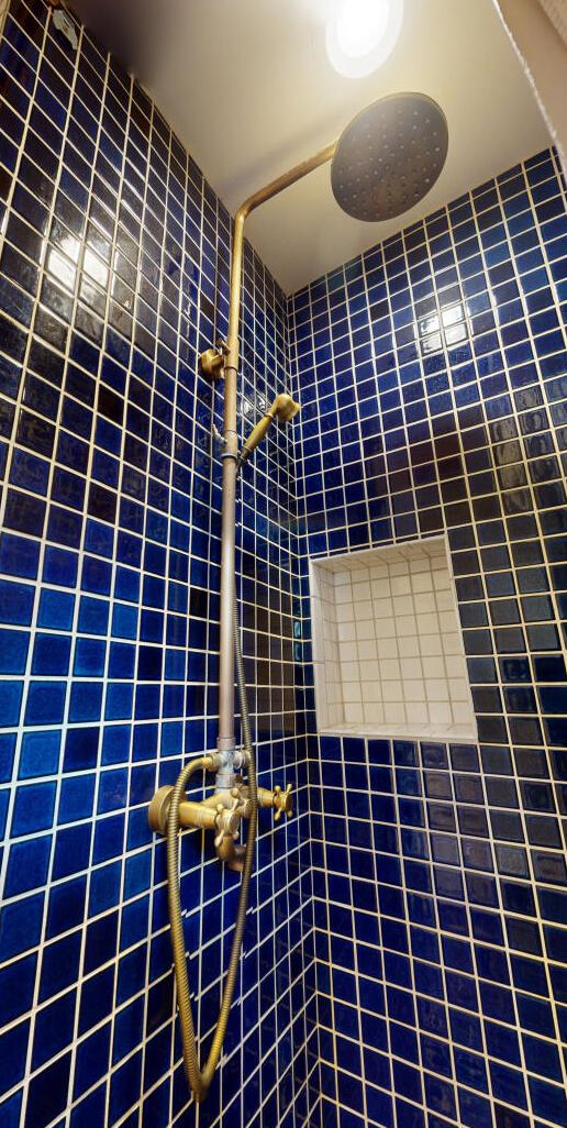 bathroom with tiled shower