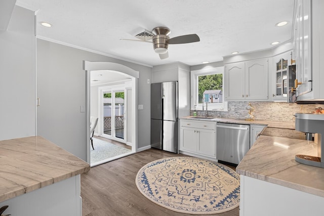 24 Tabor Rd, Forestdale, MA 02644 - kitchen with appliances with stainless steel finishes, ceiling fan, light countertops, wood finished floors, and recessed lighting