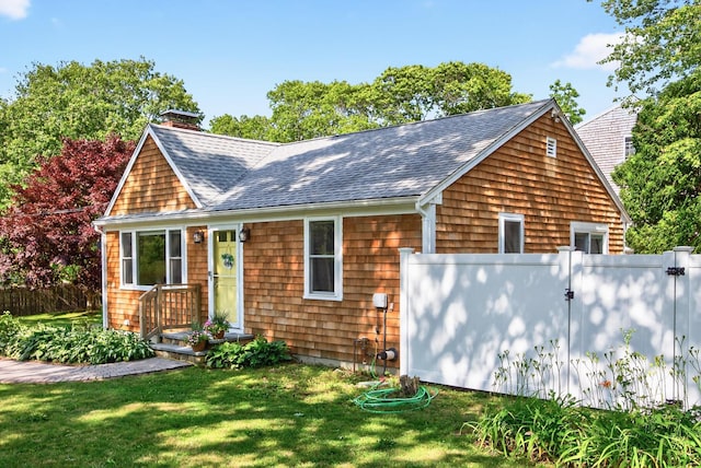 24 Tabor Rd, Forestdale, MA 02644 - view of front of home with roof with shingles and a chimney