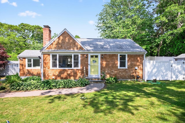 24 Tabor Rd, Forestdale, MA 02644 - view of front of property with a chimney and roof with shingles