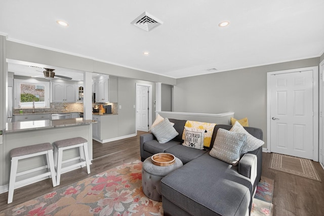 24 Tabor Rd, Forestdale, MA 02644 - living area featuring wood finished floors, recessed lighting, crown molding, and ceiling fan