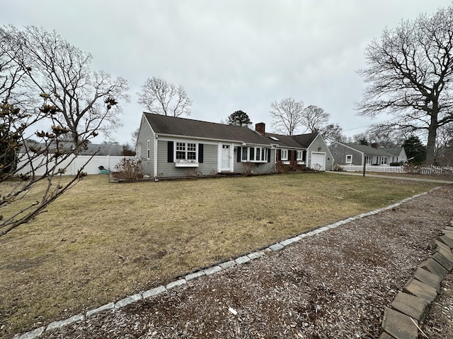 view of front facade with a garage and a front lawn